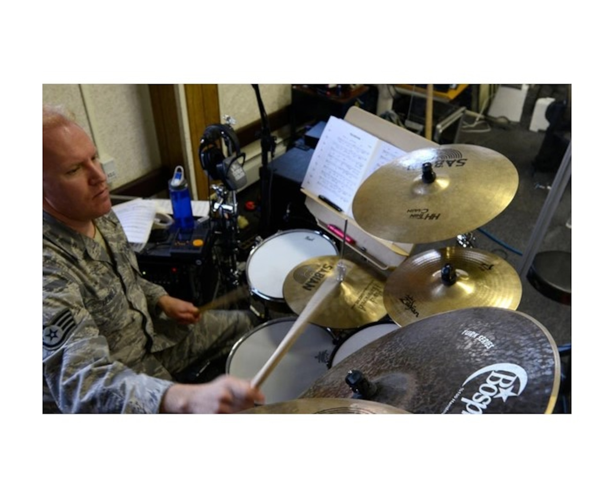 Air Force Staff Sgt. Mike Henrie practices for “Sounds of the Season,” an annual holiday concert held at the Atwood Concert Hall in December.