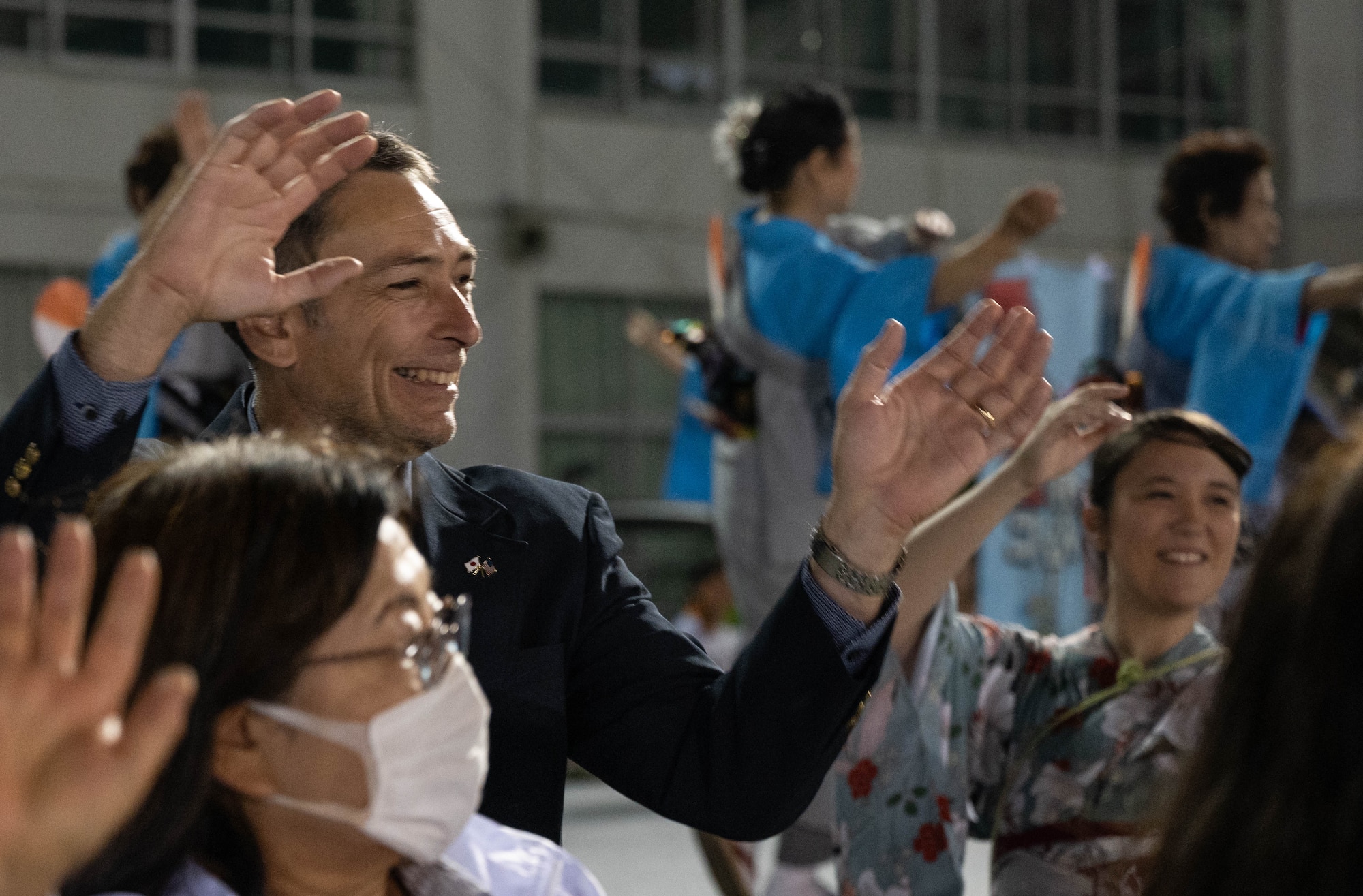 The wing commander dances during a festival.