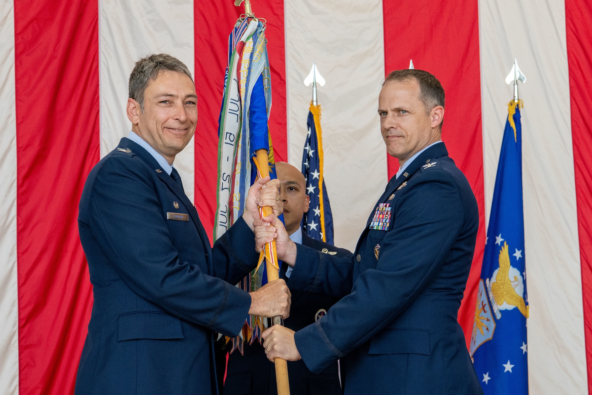 Airmen and civilians at a formal ceremony