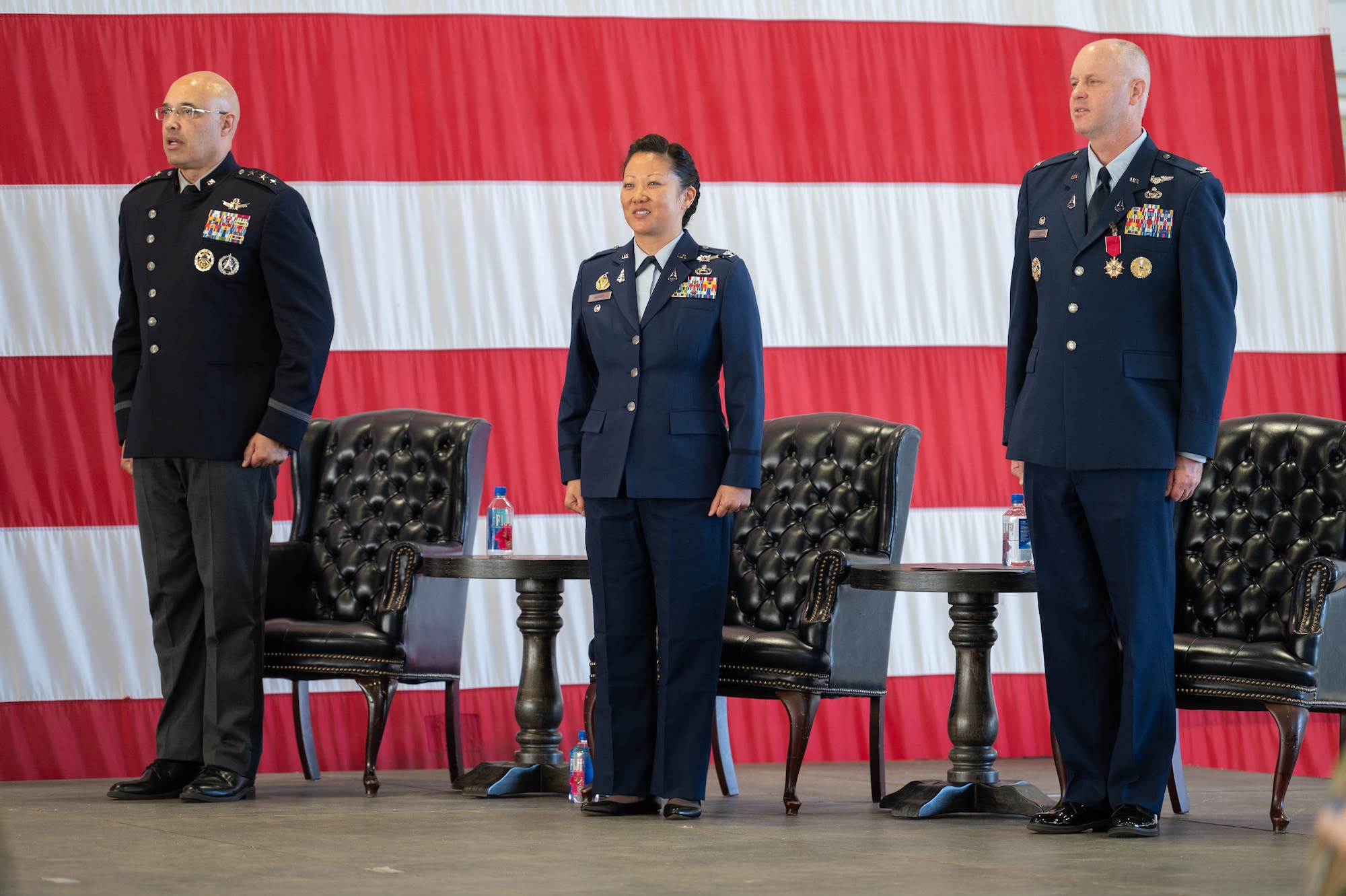 From the left, U.S. Space Force Lt. Gen. David N. Miller, Jr, Space Operations Command commander, Col. Phoenix L. Hauser, Space Delta 7 - Intelligence, Surveillance and Reconnaissance commander, and Col. Brett T. Swigert, former DEL 7 commander, sing the official U.S. Space Force song during a change of command ceremony.