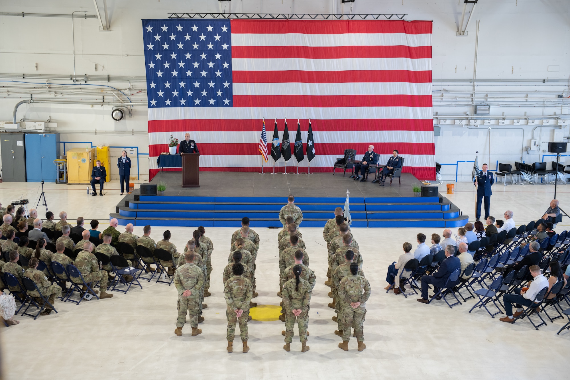 Guardians and Airmen stand in formation for the DEL 7 change of command ceremony.