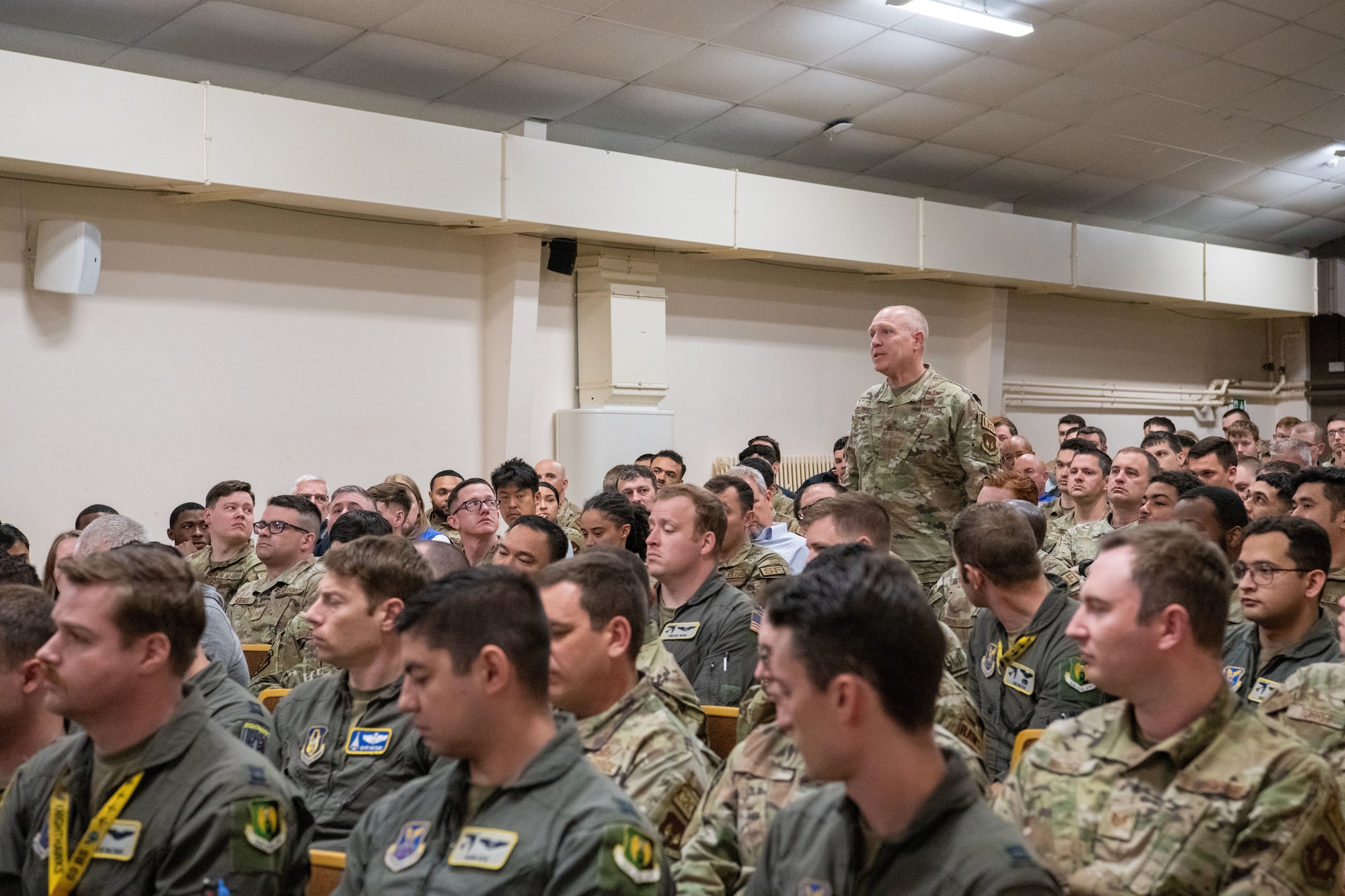 An Airman asks a question during an all-call