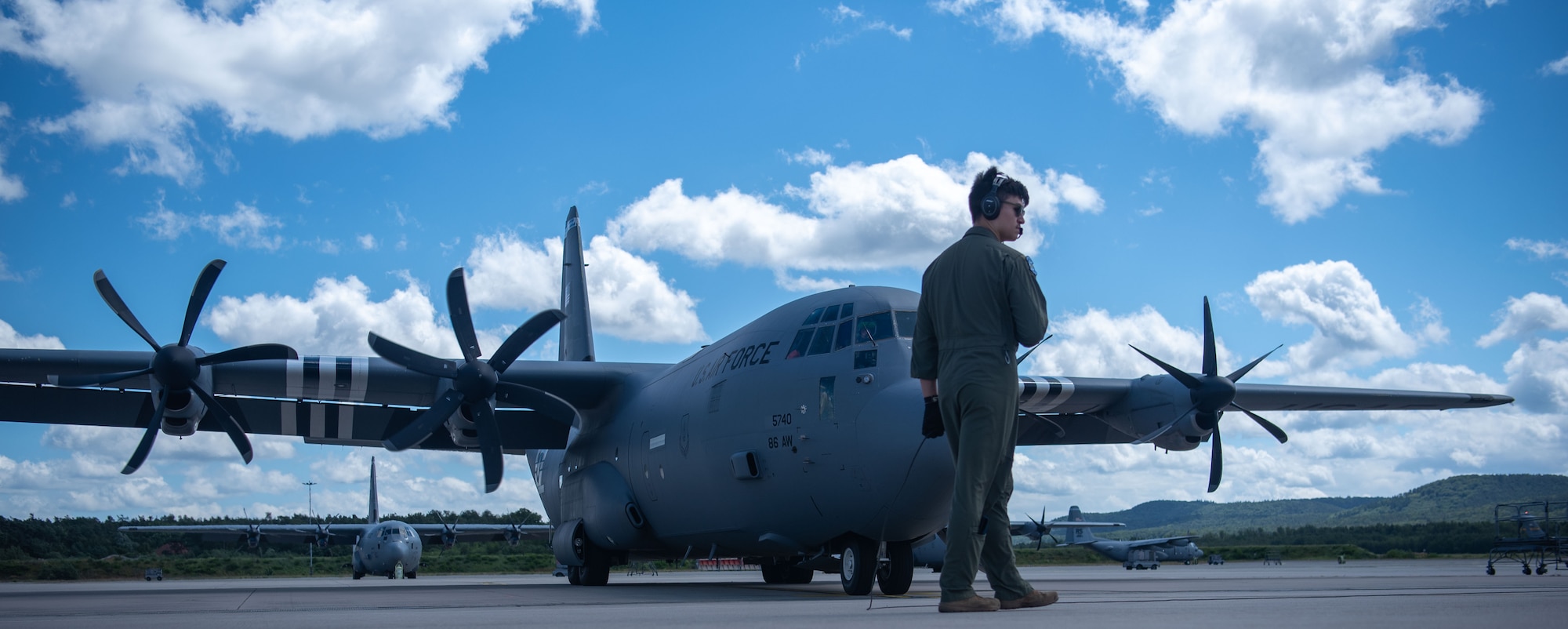 A person walks in front of plane