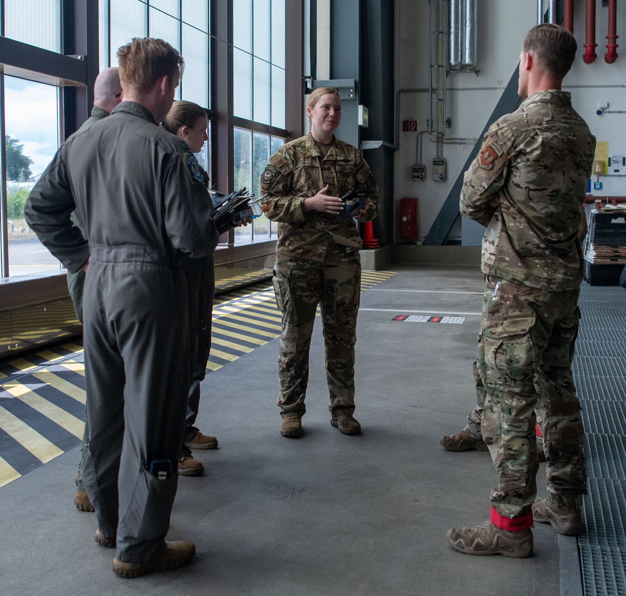 Load masters and jump masters talk before going onto plane