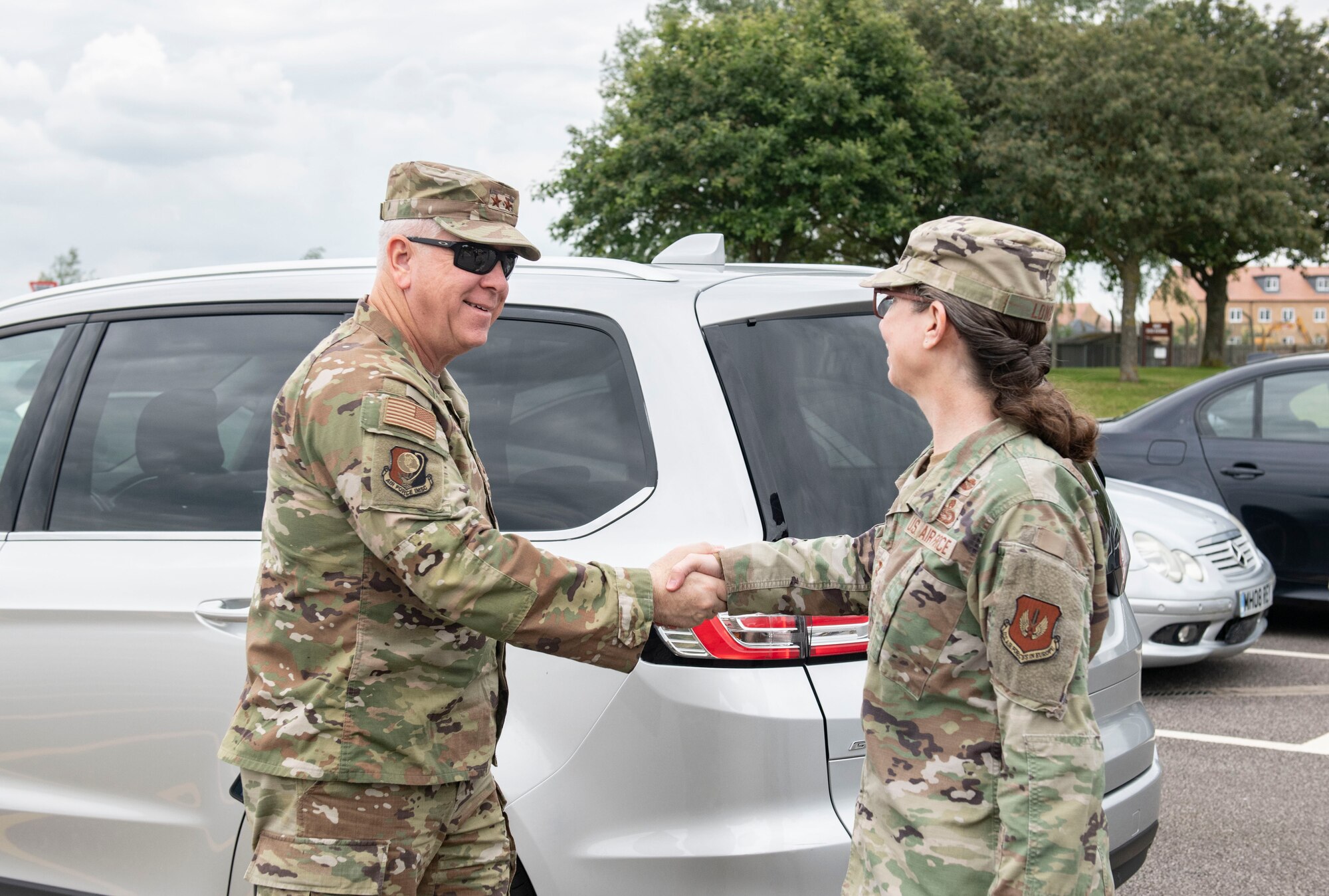 Airmen shake hands
