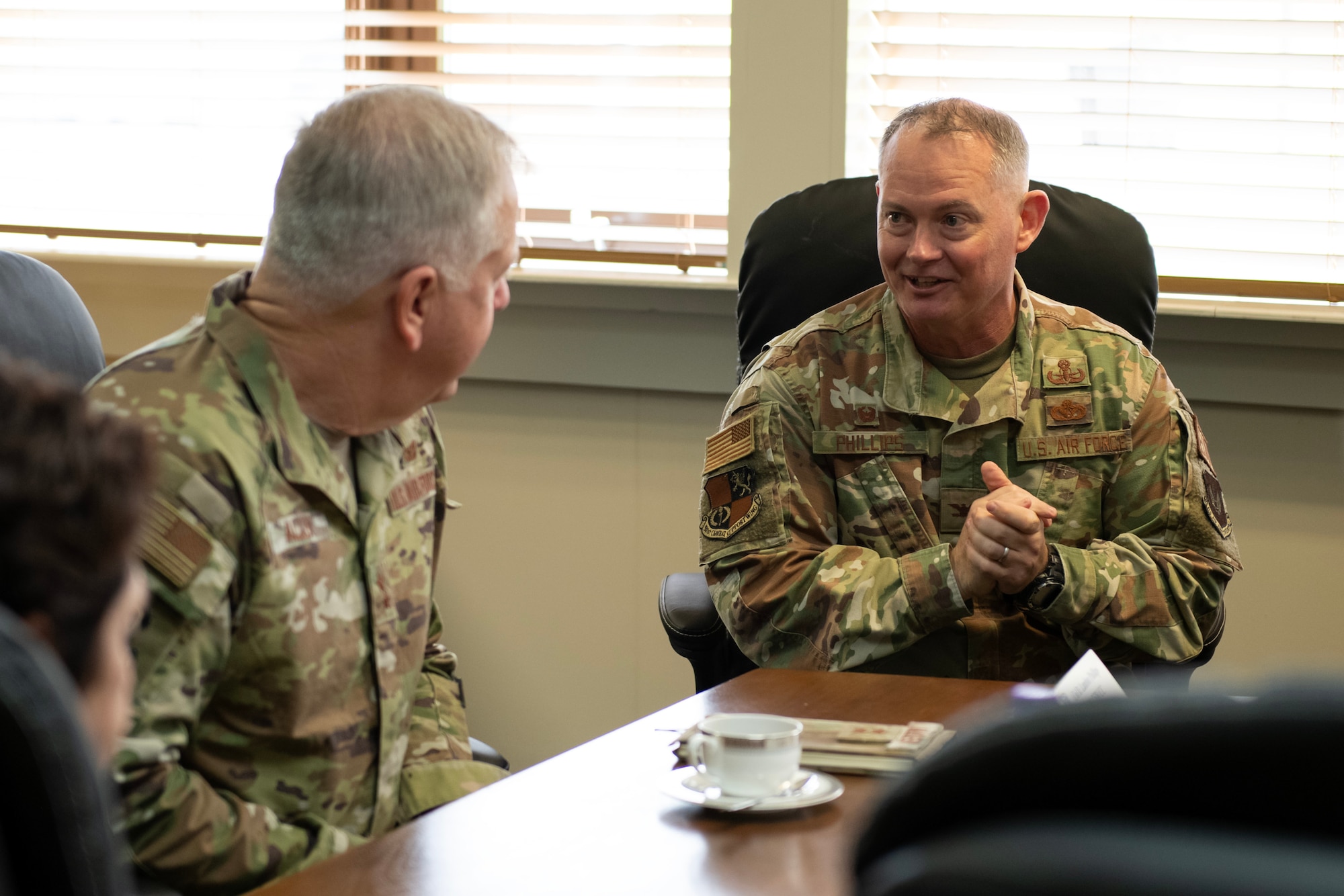 Airmen brief while sitting