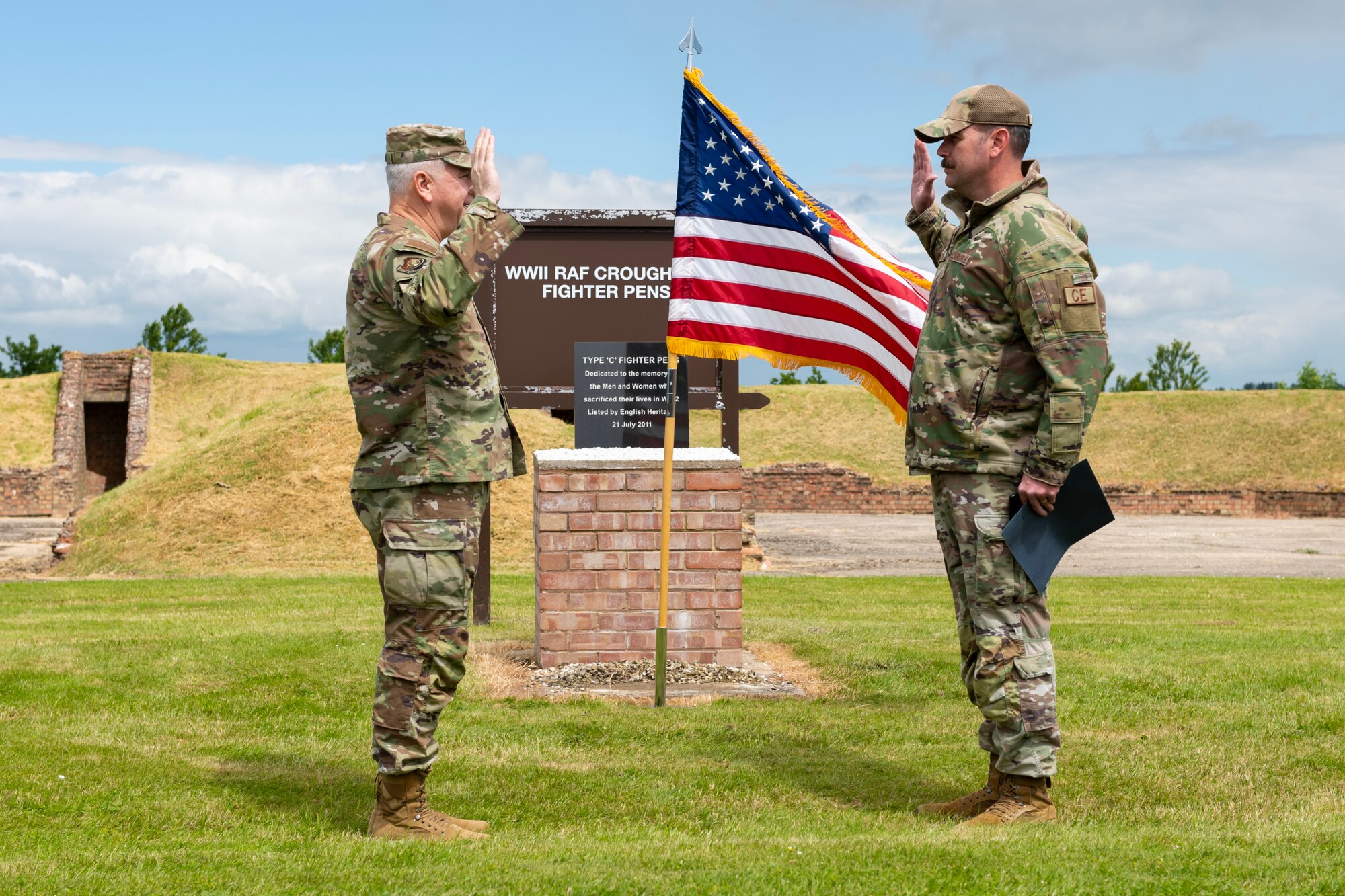 Airmen raise hands to reenlist