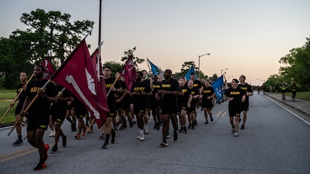 Soldiers from the Dwight D. Eisenhower Army Medical Center run in formation during Fort Eisenhower's 5k fun run celebrating the 249th birthday of the U.S. Army, June 14, 2024.