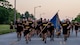 Soldiers from the 706th Military Intelligence Battalion run in formation during Fort Eisenhower's 5k fun run celebrating the 249th birthday of the U.S. Army, June 14, 2024.