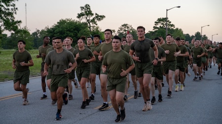 Marines from the Marine Detachment, Fort Eisenhower run in formation during Fort Eisenhower's 5k fun run celebrating the 249th birthday of the U.S. Army, June 14, 2024.