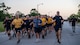 Sailors from Navy Information Operations Command, Georgia run in formation during Fort Eisenhower's 5k fun run celebrating the 249th birthday of the U.S. Army, June 14, 2024.