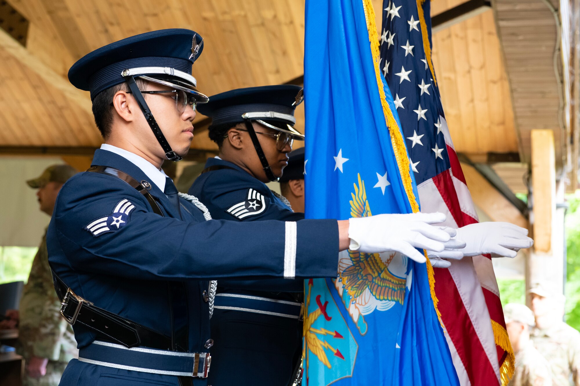 The 422d Air Base Group honor guard present the colors during an assumption of command ceremony