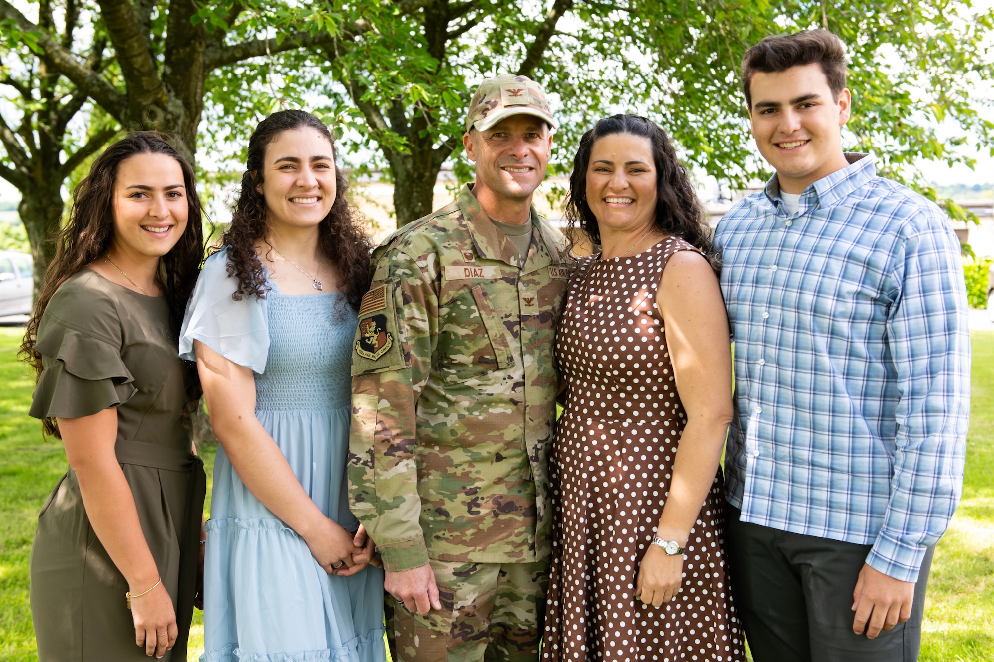 A family stands for a group photo