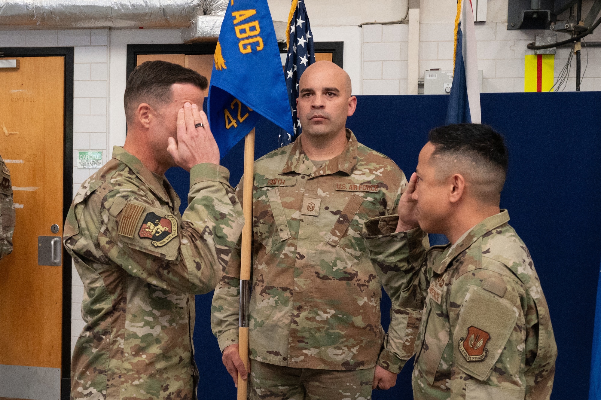 U.S. Air Force Col. Ricardo M. Diaz, left, 422nd Air Base Group commander, salutes Maj. Marques L. Reyes, right, 420th Munitions Squadron incoming commander, during a change of command ceremony