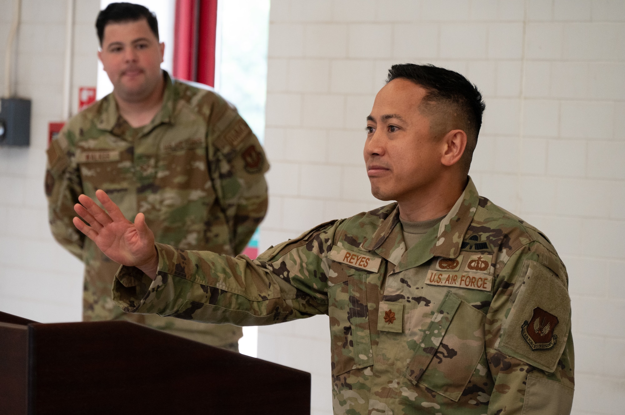 U.S. Air Force Maj. Marques L. Reyes, 420th Munitions Squadron incoming commander, gives a speech during a change of command ceremony