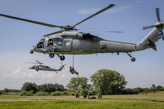 EOD technicians conduct helicopter rope suspension techniques  during fast-rope and rappelling training in Putlos, Germany