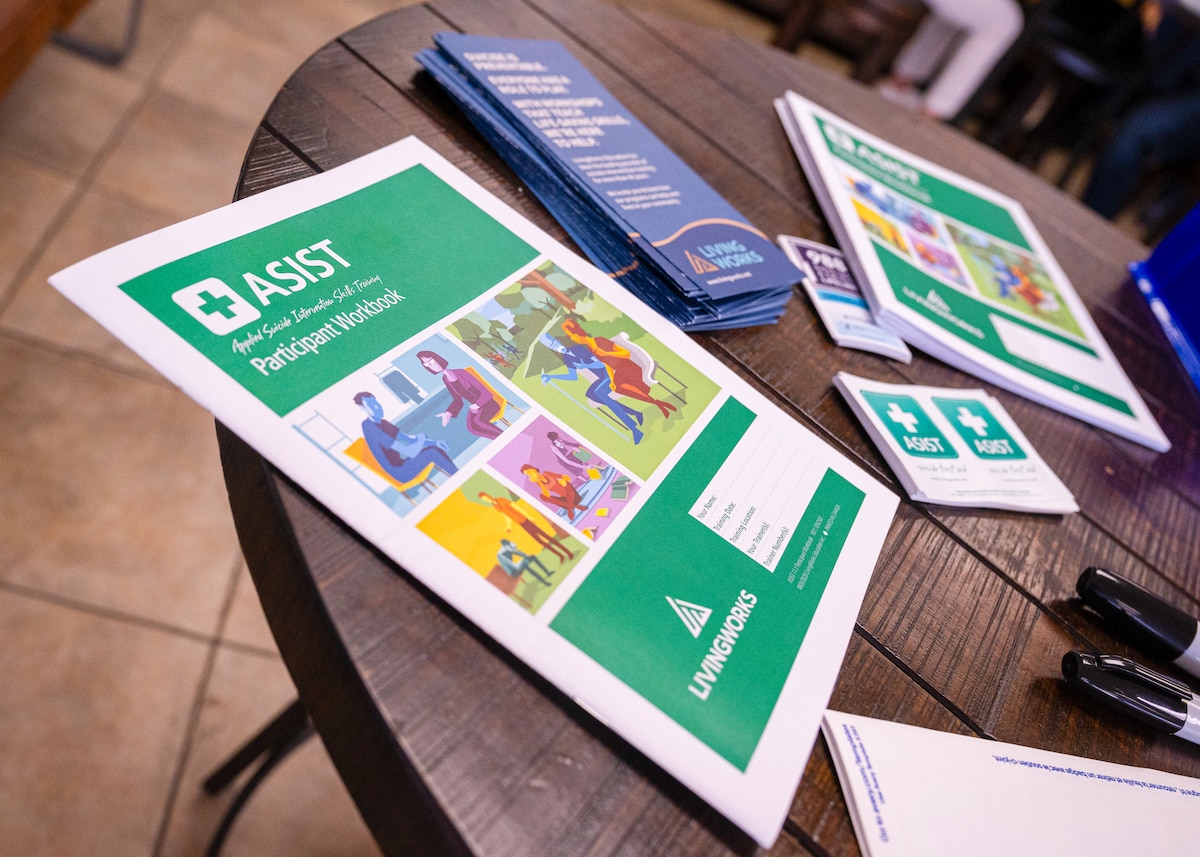 A workbook sits on display at an Applied Suicide Intervention Skill Training workshop, June 11, 2024, at Luke AFB, Arizona.