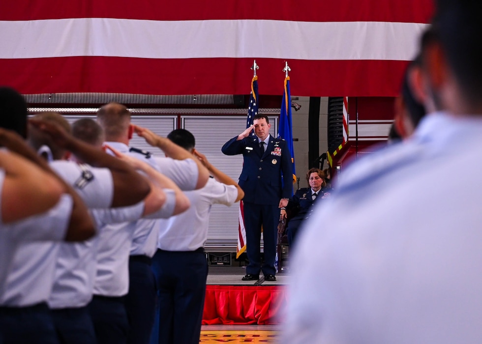 Members of the 17th Training Group salute U.S. Air Force Col. Jason Gerber, incoming 17th TRG commander, during the change of command ceremony at the Louis F. Garland Department of Defense Fire Academy, Goodfellow Air Force Base, Texas, June 14, 2024. The first salute represents the squadron welcoming its new commander. (U.S. Air Force photo by Senior Airman Zach Heimbuch)