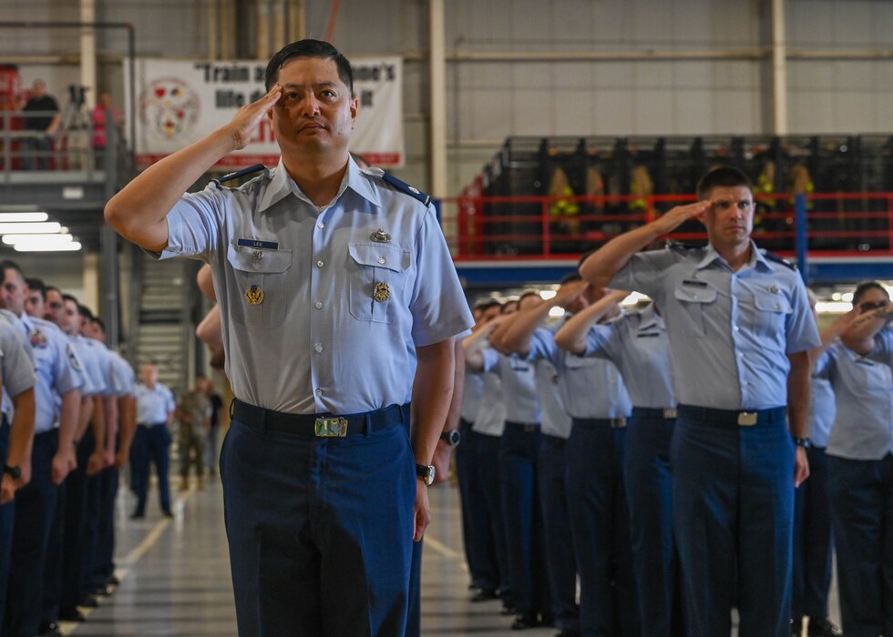 Members of the 17th Training Group render a final salute to U.S. Air Force Col. Jason Kulchar, outgoing 17th TRG commander, during the change of command ceremony at the Louis F. Garland Department of Defense Fire Academy, Goodfellow Air Force Base, Texas, June 14, 2024. The mission of the 17th Training Group is to Train, Develop and Inspire Professional Fire Protection and intelligence, surveillance and reconnaissance Warriors. (U.S. Air Force photo by Senior Airman Zach Heimbuch)