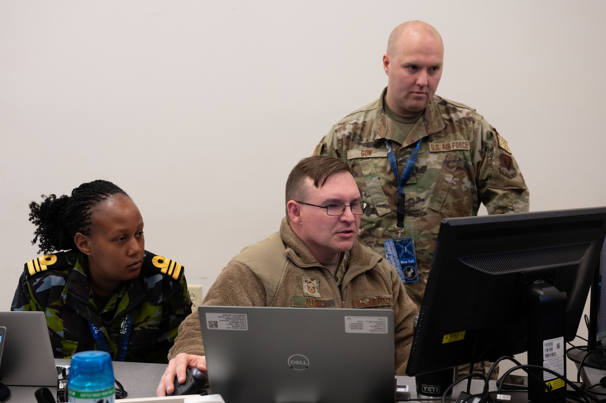 Airmen type on computers.