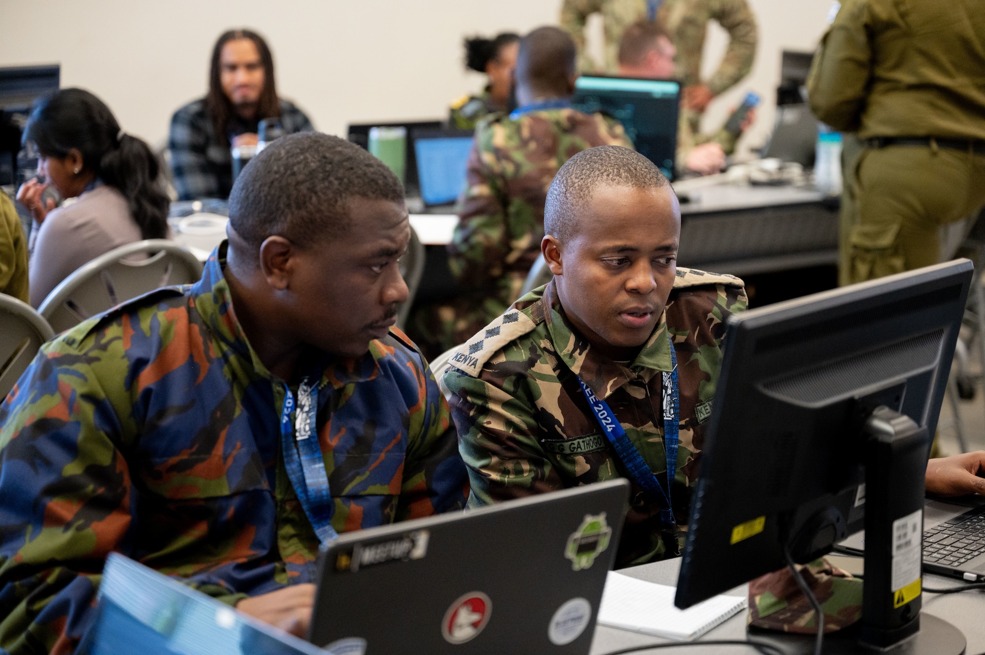 Airmen type on computers.