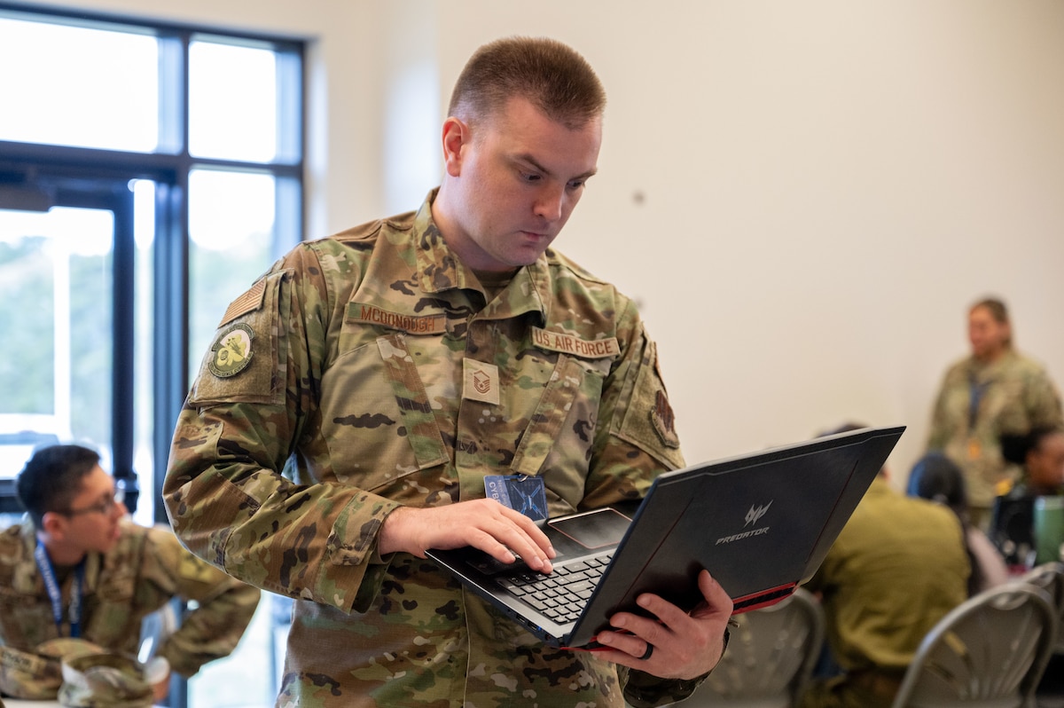 Airmen type on computers.