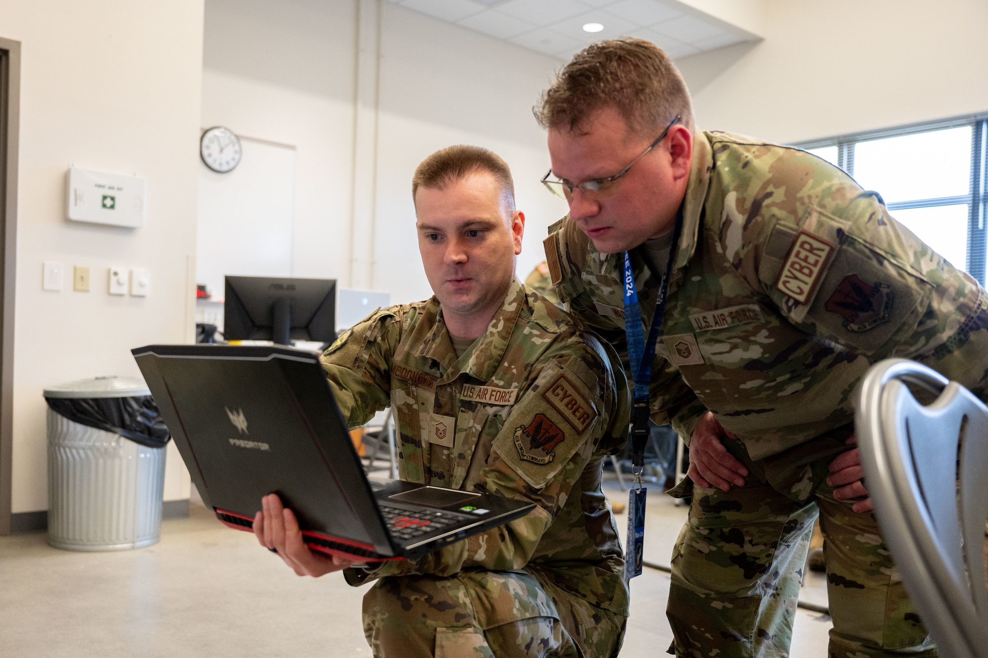 Airmen type on computers.