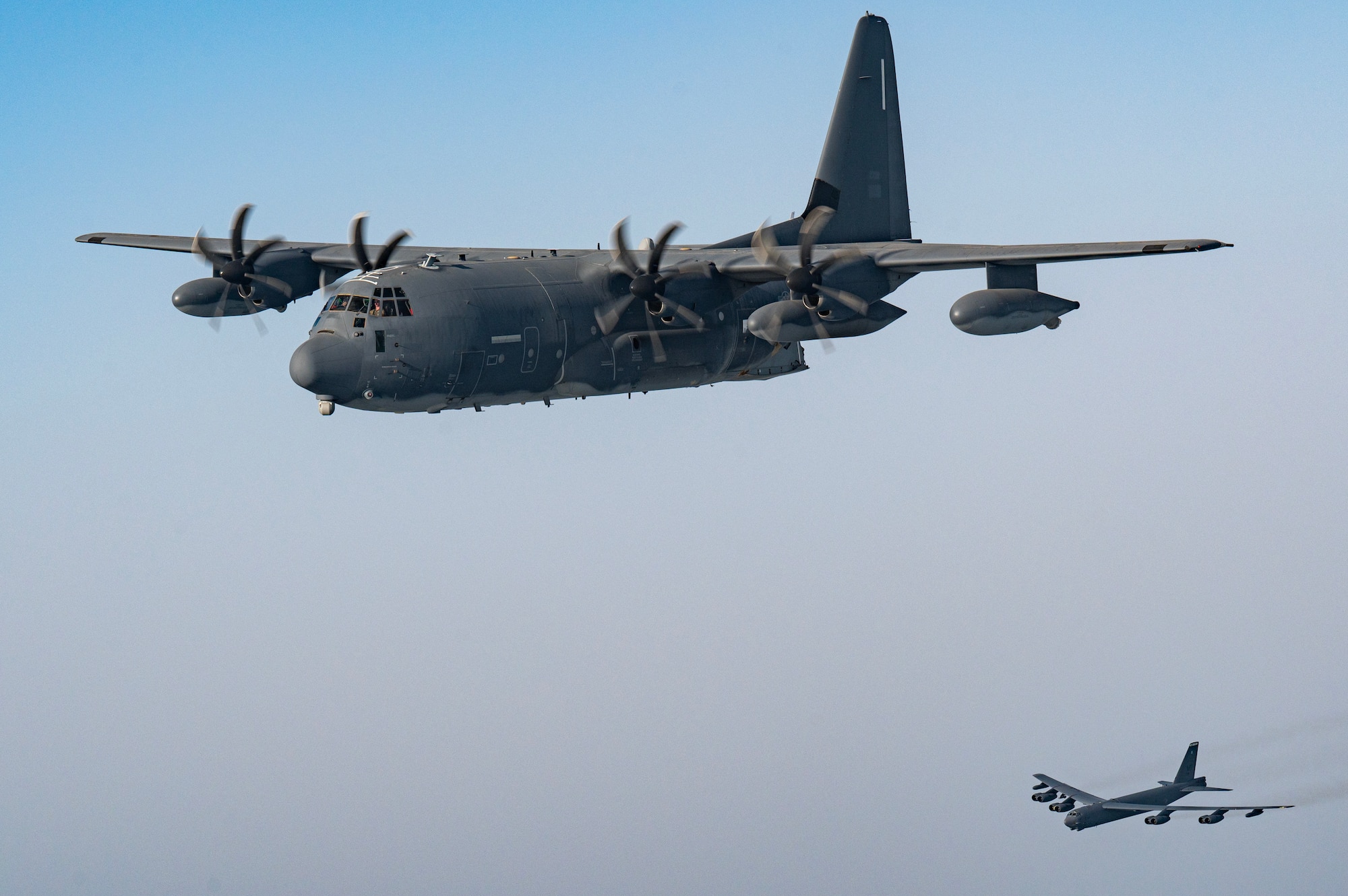 A U.S. Air Force MC-130J Commando II operated by U.S. Special Operations Command-Central flies ahead of a U.S. Air Force B-52H Stratofortress from Minot Air Force Base’s 69th Expeditionary Bomb Squadron, June 12, 2024, during a Bomber Task Force mission over U.S. Central Command’s area of responsibility. U.S. Air Forces Central led the combined effort to integrate with U.S. joint and coalition forces to highlight the critical long-range strategic bomber capability. (U.S. Air Force photo)