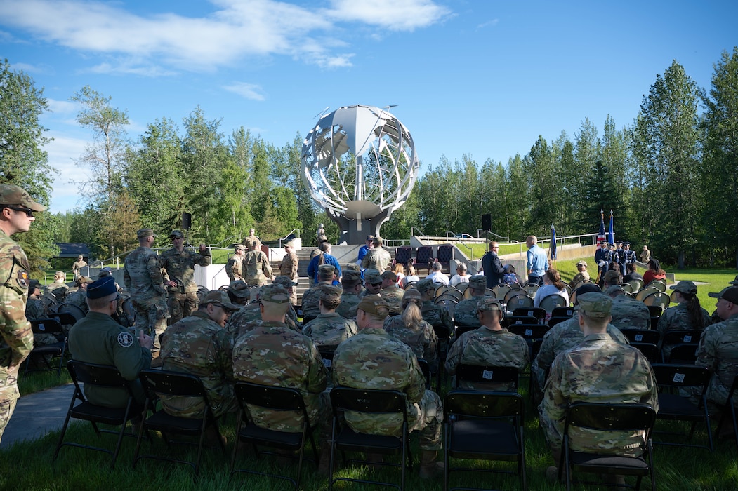 U.S. Air Force members from the 354th Fighter Wing gather for the start of the Command Chief Change of Responsibility ceremony at Eielson Air Force Base, Alaska, June 7, 2024.