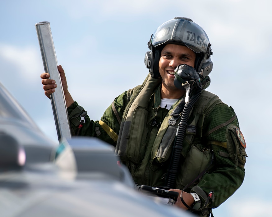 A pilot from the Indian Air Force climbs into the cockpit of a Rafale aircraft.