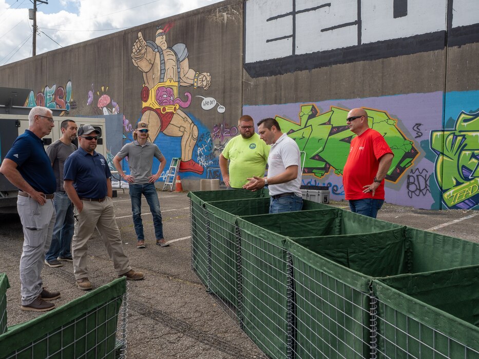 George Minges, Louisville District Emergency Operations chief, demonstrates the placements and correct use of barriers during flood fight training, May 29, 2024, in Covington, Ky.