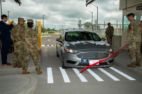 U.S. Air Force Col. Joseph Contino, 914th Air Refueling Wing commander, drives his staff vehicle through a ribbon at the new main gate facility on Niagara Falls Air Reserve Station May 29, 2024.