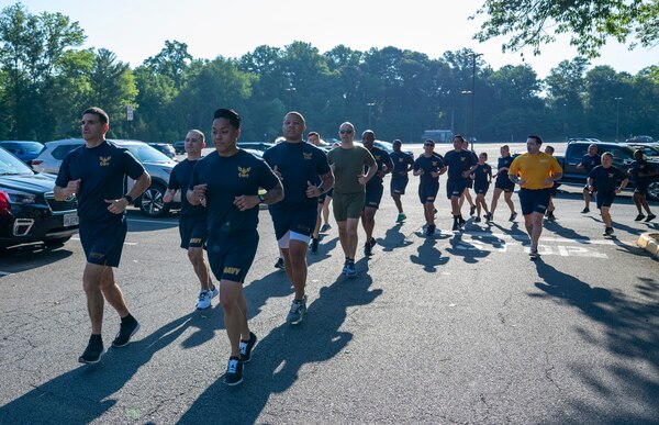 Rear Adm. Rick Freedman, Navy Deputy Surgeon General, and Force Master Chief PatrickPaul Mangaran, director of the Hospital Corps, lead Sailors assigned to U.S. Navy Bureau of Medicine and Surgery headquarters in a commemorative command run for the 126th Hospital Corps birthday at the Defense Health Headquarters in Falls Church, Virginia, June 14.