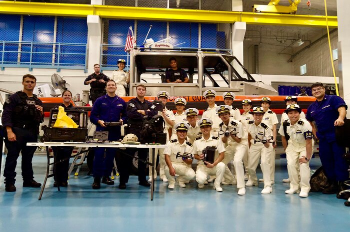 U.S. Coast Guard Forces Micronesia Sector Guam and Maritime Safety and Security Team Honolulu personnel stand for a photo with over 40 cadets from the Japanese Coast Guard training ship Kojima during their visit to Guam on June 12, 2024. The event marked a significant moment of international cooperation and camaraderie between the two maritime services. (U.S. Coast Guard photo by Josiah Moss)