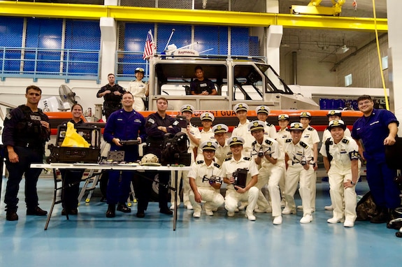 U.S. Coast Guard Forces Micronesia Sector Guam and Maritime Safety and Security Team Honolulu personnel stand for a photo with over 40 cadets from the Japanese Coast Guard training ship Kojima during their visit to Guam on June 12, 2024. The event marked a significant moment of international cooperation and camaraderie between the two maritime services. (U.S. Coast Guard photo by Josiah Moss)