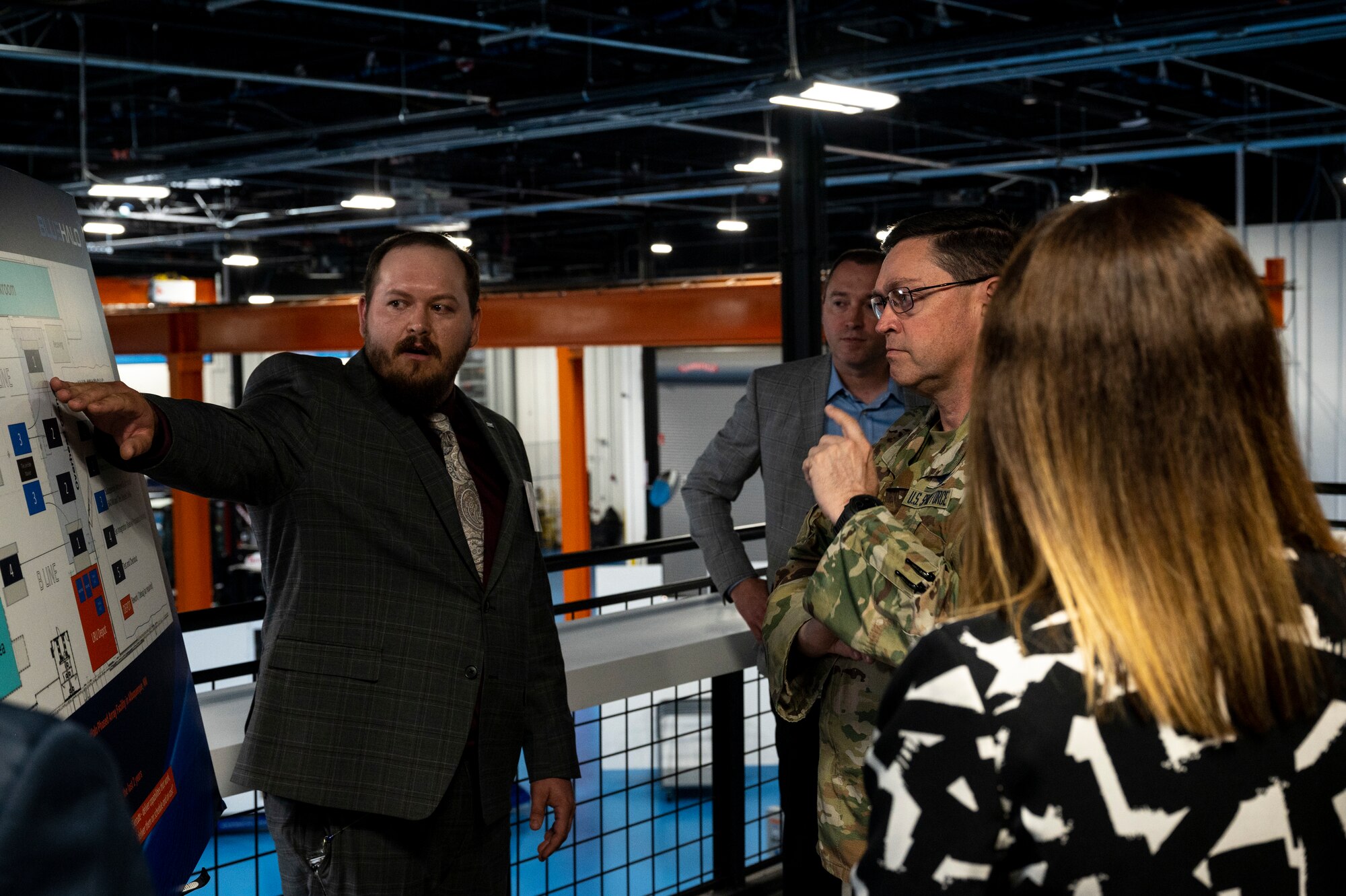 Man is briefed by another man.