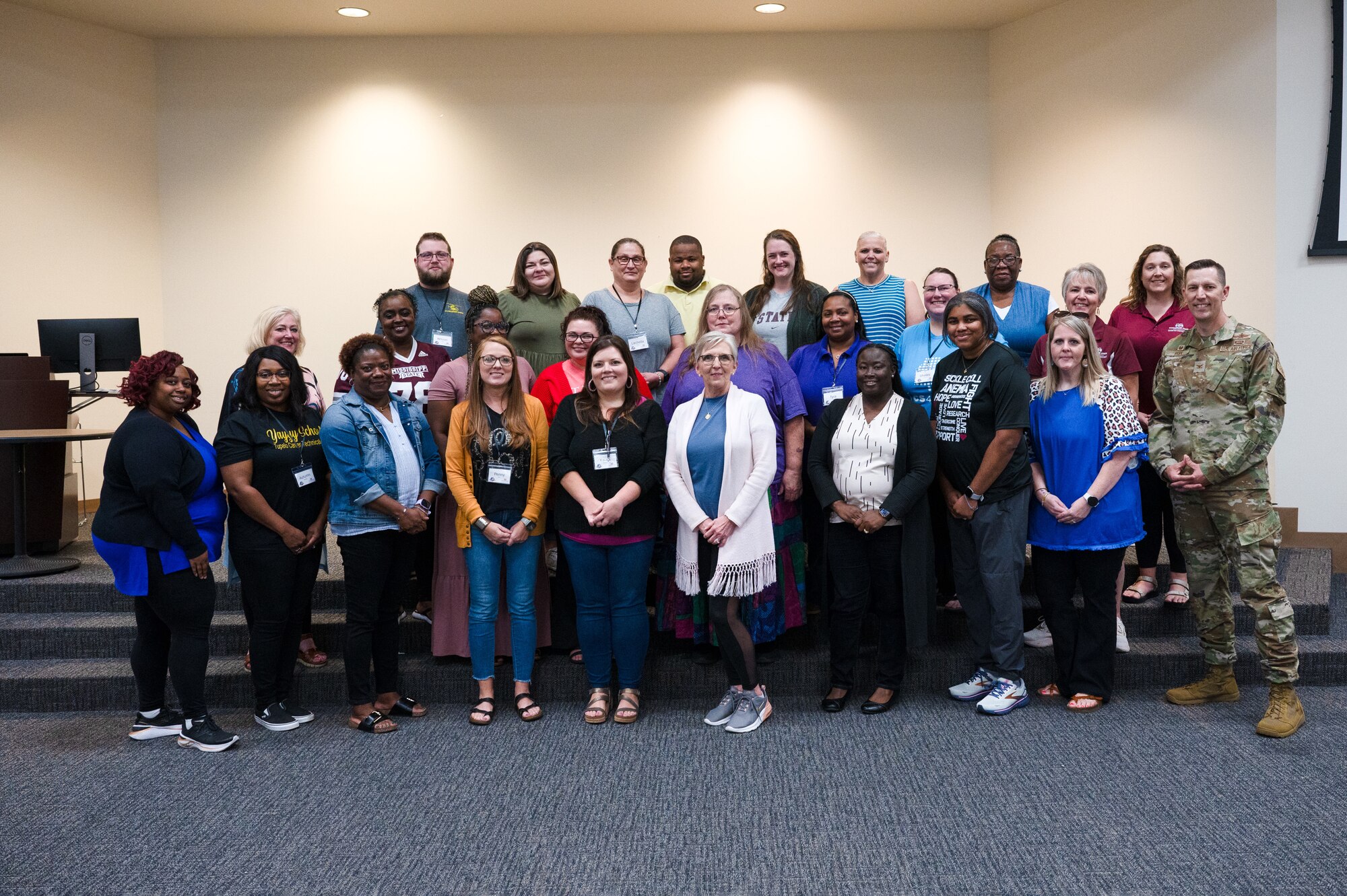 U.S. Air Force Col. Billy Pope, Jr., 81st Training Wing commander, poses with teachers for a group photo during the Mississippi State University GenCyber camp at Keesler Air Force Base, Mississippi, June 7, 2024.