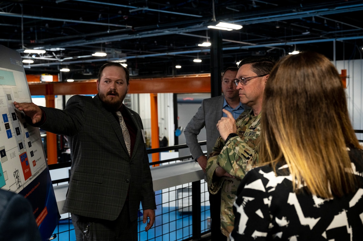 Man is briefed by another man.