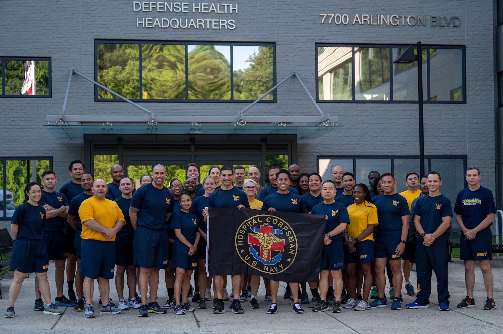 Rear Adm. Rick Freedman, Navy Deputy Surgeon General, and Force Master Chief PatrickPaul Mangaran, director of the Hospital Corps, pose with Sailors assigned to U.S. Navy Bureau of Medicine and Surgery headquarters before a commemorative command run for the 126th Hospital Corps birthday at the Defense Health Headquarters in Falls Church, Virginia, June 14.