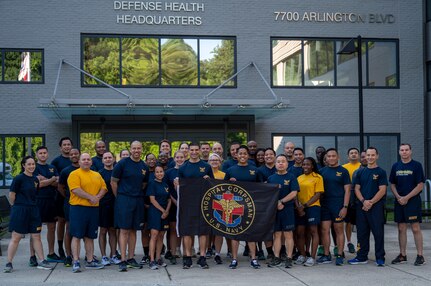 Rear Adm. Rick Freedman, Navy Deputy Surgeon General, and Force Master Chief PatrickPaul Mangaran, director of the Hospital Corps, pose with Sailors assigned to U.S. Navy Bureau of Medicine and Surgery headquarters before a commemorative command run for the 126th Hospital Corps birthday at the Defense Health Headquarters in Falls Church, Virginia, June 14.