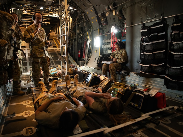 Patients in the cargo bay of a military aircraft.