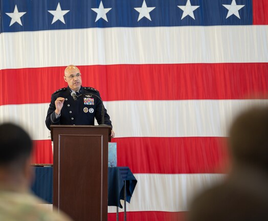  Lt. Gen. David N. Miller, Jr speaks to audience from a podium during the Space Delta 7 - Intelligence, Surveillance and Reconnaissance change of command ceremony at Peterson Space Force Base.