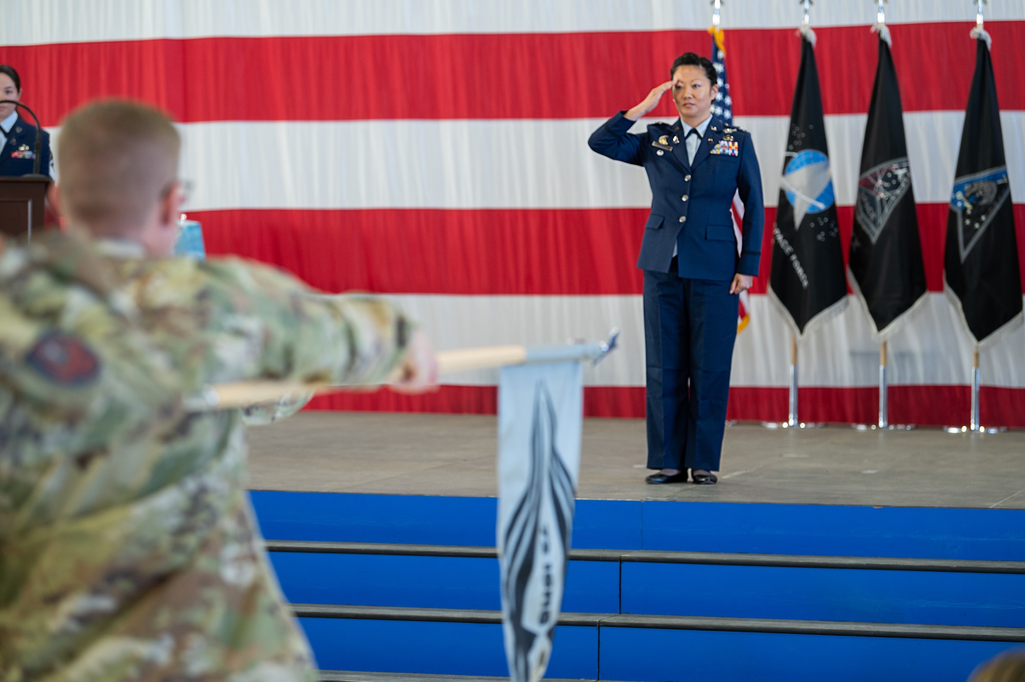 Col. Phoenix L. Hauser gives her first salute as Space Delta 7 - Intelligence, Surveillance and Reconnaissance commander to the men and women of DEL 7.