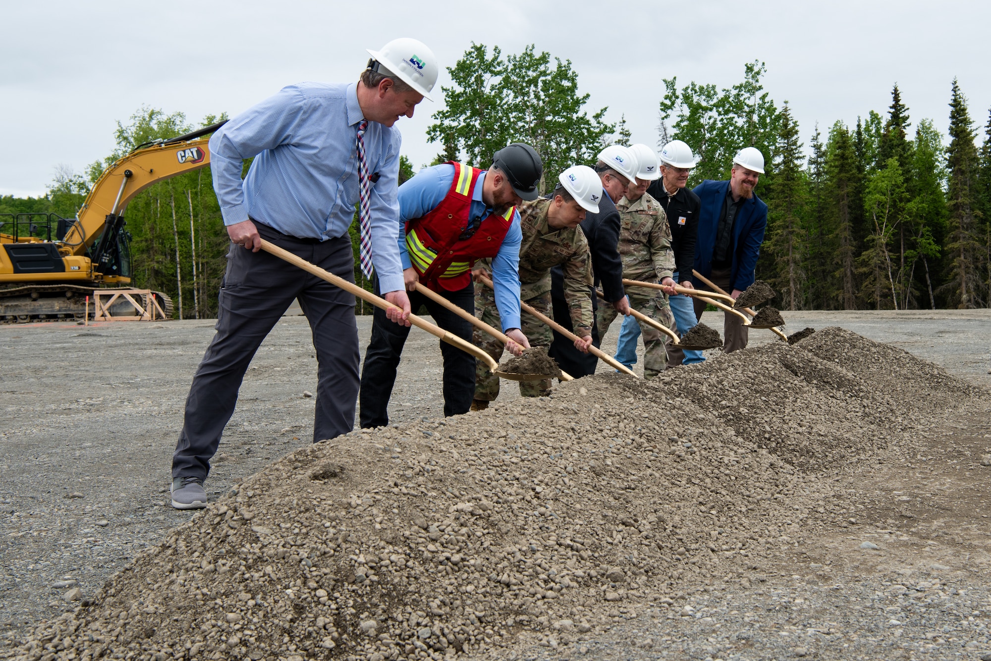 JBER leaders and project leads broke dirt at the construction site to symbolize the beginning of the project, while service members and civilians gathered to celebrate.