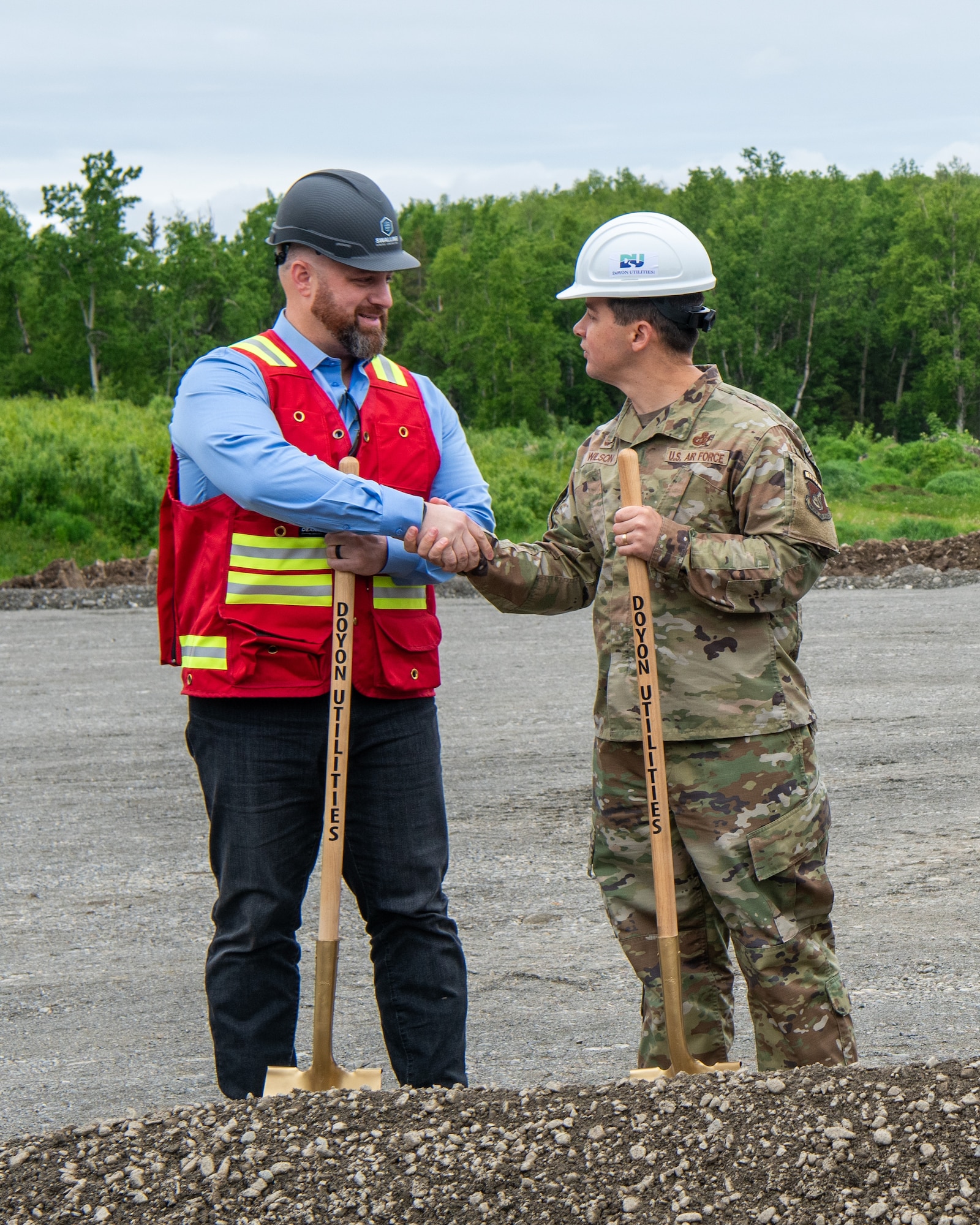 JBER leaders and project leads broke dirt at the construction site to symbolize the beginning of the project, while service members and civilians gathered to celebrate.