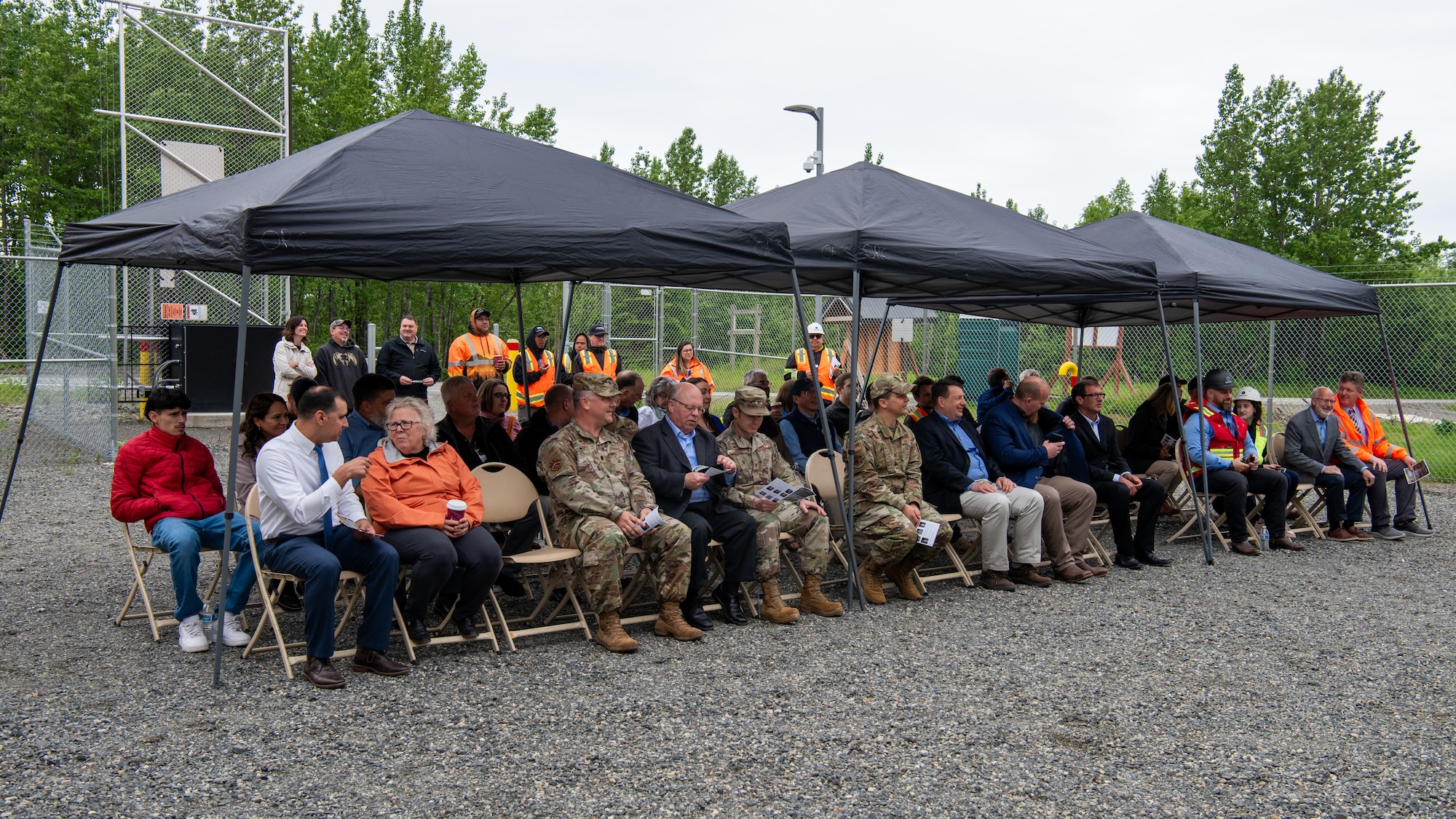 JBER leaders and project leads broke dirt at the construction site to symbolize the beginning of the project, while service members and civilians gathered to celebrate.