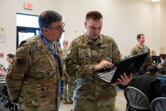 Airmen type on computers.