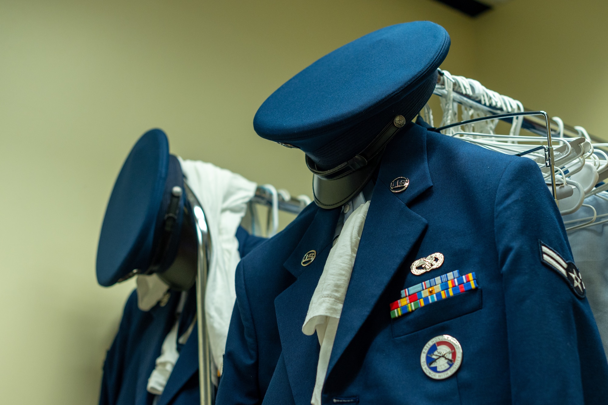 A 51st Fighter Wing Honor Guard uniform hangs in a closet to keep quality condition at Osan Air Base, Republic of Korea, June 12, 2024. An honor guard member earns their badge once they have completed their first detail in a ceremony. (U.S. Air Force photo by Senior Airman Kaitlin Frazier)