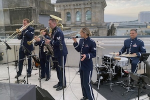 The Wings of Swing, part of the U.S. Air Forces in Europe-Air Forces Africa band, performs during a reception on the roof of the Bundestag, the German federal parliament building, as part of the activities related to the Berlin Innovation and Leadership in Aerospace trade show and air show, June 6, 2024, in Berlin, Germany. The band’s mission is to build relationships through a shared love of music. The band played at the industry days, ceremonial events at government centers in Berlin, and at the show’s public days. (U.S. Air Force photo by Senior Master Sgt. Dan Heaton)