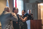 Chief Warrant Officer 5 Teneshea Jones, of Oklahoma City, is pinned with her new rank of chief warrant officer 5 during her promotion ceremony in Oklahoma City, June 2, making her the first African American female to achieve the rank. Jones currently serves as the senior human resource warrant officer in the Oklahoma Army National Guard’s Joint Force Headquarters. Less than one percent of warrant officers achieve the rank of chief warrant officer five, making it one of the rarest ranks to attain within the OKARNG. (Oklahoma National Guard photo by Spc. Anthony Ackah-Mensah)